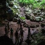 tour group from Hamanasi resort exiting St Herman&#039;s cave in Belize